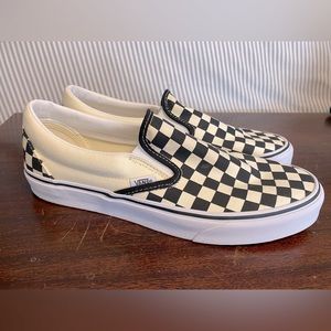 Black and white checkered slip on Vans.